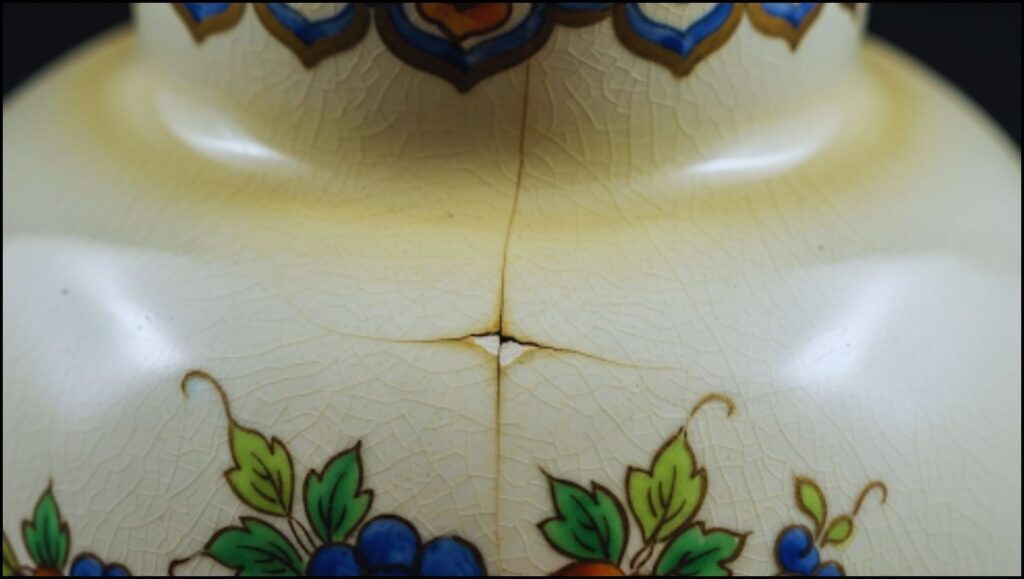9 Things to Avoid at an Estate Sale, According to Expert Shoppers 2 vintage vase with a small crack